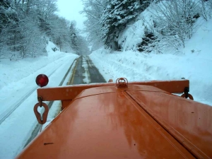 view from inside a plow during a snowstorm