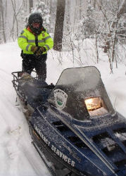 Officer with a snowmobile